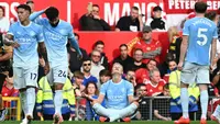Striker Manchester City, Erling Haaland, merayakan golnya ke gawang Manchester United dalam lanjutan Premier League 2026/2027 di Old Trafford, Minggu (13/9/2026) malam WIB. (Paul ELLIS / AFP)
