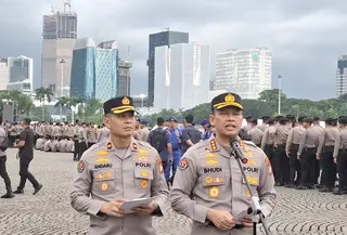 Kabid Humas Polda Metro Jaya Kombes Pol Budhi Hermanto bicara soal pengamanan perayaan Hari Buruh Internasional atau May Day di Jakarta, Jumat (1/5/2026). (Liputan6.com/Rifqy Alief Abiyya)