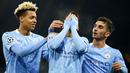 Bek Manchester City, Joao Cancelo, melakukan selebrasi usai mencetak gol ke gawang Olympiakos pada laga Liga Champions di Stadion Etihad, Rabu (4/11/2020). Manchester City menang dengan skor 3-0. (AP/Dave Thompson)