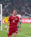 Pemain Timnas Indonesia Ole Romeny meluapkan emosinya setelah assist yang diberikannya berhasil dikonversi menjadi gol oleh Mitchell Baker saat menghadapi Bangladesh pada pertandingan Grup A FIFA ASEAN Cup 2026 di Jakarta, Kamis (1/10/2026). (KLY/Budy Santoso)