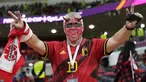 Suporter timnas Belgia bersorak sebelum  laga pembuka Grup F Piala Dunia 2022 Qatar melawan Kanada, di Stadion Ahmad Bin Ali di Doha, Kamis (24/11/2022) dini hari WIB. Timnas Belgia mengawali perjalanannya di Piala Dunia 2022 dengan hasil positif dan mampu menang 1-0 atas Kanada. (AP Photo/Darko Bandic)