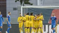 Para pemain Belgia merayakan gol ke gawang Islandia pada Liga A Grup 2 UEFA Nations League, di Reykjavik, Selasa (11/9/2018). (AFP/Haraldur Gudjonsson)