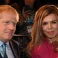 Pm Inggris Boris Johnson dan tunangannya Carrie Symonds. (dok. foto Jeremy Selwyn / POOL / AFP)