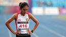 Pelari putri Indonesia, Odekta Elvina Naibaho setelah menyelesaikan nomor lari 10.000 meter SEA Games 2023 di Stadion Morodok Techo National Stadium, Phnom Penh, Kamboja, Jumat (12/5/2023). Odekta meraih medali perunggu dengan catatan waktu 35 menit 31,03 detik sementara medali emas dan perak direbut dua atlet Vietnam, Thi Oanh Nguyen (35 menit 11,53 detik) dan Thi Hong Le Pham (35 menit 21,09 detik). (Bola.com/Abdul Aziz)
