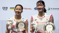 Jepang menjadi juara umum Singapura Terbuka 2019 setelah memborong tiga gelar melalui nomor tunggal putra, ganda putra, dan ganda putri. (AFP/Theodore Lim)