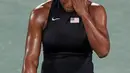 Petenis AS, Serena Williams menutupi wajahnya dengan tangan usai dikalahkan petenis Ukraina, Elina Svitolina di babak ketiga Olimpiade Rio 2016 , Selasa (9/8). Kekalahan ini membuat Serena gagal menambah medali emas olimpiade. (REUTERS/Kevin Lamarque)