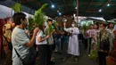 Misa Minggu Palma menjadi penanda dimulainya Pekan Suci jelang perayaan Paskah. (JUNI KRISWANTO/AFP)