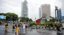 Suasana Car Free Day (CFD) di kawasan Bundaran HI, Jakarta, Minggu (2/10/2022). Meski diguyur hujan deras sejak pagi, warga tetap antusias untuk tetap berolahraga saat CFD. (Liputan6.com/Faizal Fanani)