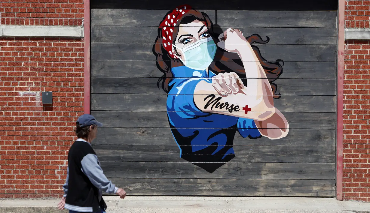 Sebuah mural di dekat rumah sakit memberi pesan penghormatan kepada para perawat selama pandemi virus corona COVID-19 di Dallas, Amerika Serikat, Rabu (15/4/2020). (AP Photo/LM Otero)