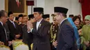 Presiden Jokowi (kiri) didampingi Menteri Agama Lukman Hakim Saifuddin menghadiri acara Peringatan Isra Miraj Nabi Muhammad SAW Tahun 1436 H/2015 M di Istana Negara, Jakarta, Jumat (15/5) malam. (Liputan6.com/Faizal Fanani)