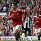 Ekspresi kegembiraan bintang Manchester United, Cristiano Ronaldo, setelah menjebol gawang Newcastle United pada lanjutan Liga Inggris di Old Trafford, Sabtu (11/9/2021). (AP Photo/Rui Vieira)