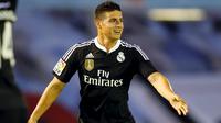 Penyerang Real Madrid, James Rodriguez merayakan selebrasi usai mencetak gol ke gawang Celta Vigo pada laga Liga Spanyol di Stadion Balaidos , Spanyol, Senin (27/4/2015). Real Madrid menang 4-2 atas Celta Vigo. (REUTERS/Miguel Vidal)