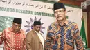 Ketua Umum PBNU KH. Said Aqil Siradj dan Ketua Umum PP Muhammadiyah H. Haedar Nashir saat silaturahim keluarga besar NU dan Muhammadiyah di kantor PBNU, Jakarta, Jumat (23/3). (Liputan6.com/Herman Zakharia)