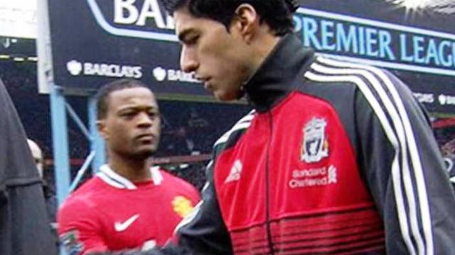 Patrice Evra dan Luis Suarez