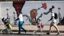 Kunjungan ini merupakan rangkaian dari kunjungan apostolik Paus Fransiskus di Asia-Pasifik. Sebelumnya, Paus Fransiskus bertandang ke Indonesia, Papua Nugini dan berakhir di Singapura. (Yasuyoshi CHIBA/AFP)