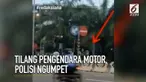 Aksi polisi ini membuat pengendara kaget.