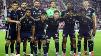 Pemain Vancouver Whitecaps FC berpose untuk foto tim sebelum pertandingan Leg Kedua Semifinal Piala Champions CONCACAF antara Inter Miami CF dan Vancouver Whitecaps di Chase Stadium pada tanggal 30 April 2025 di Fort Lauderdale, Florida. (Leonardo Fernandez/Getty Images via AFP)