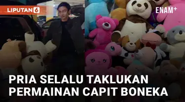 Aksi seorang pria tidak pernah gagal ketika bermain capit boneka menarik perhatian