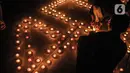 Para aktivis dari berbagai elemen masyarakat sipil menggelar aksi solidaritas menyalakan lilin untuk mengenang Brigadir Novriansyah Joshua Hutabarat alias Brigadir J di kawasan Taman Ismail Marzuki (TIM), Jakarta, Kamis (18/8/2022). Aksi solidaritas keadilan bertajuk 4.000 lilin digelar untuk memperingati 40 hari kematian Brigadir Nofriansyah Yosua Hutabarat alias Brigadir J. (merdeka.com/Iqbal S. Nugroho)