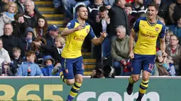 Aaron Ramsey melakukan selebrasi gol. Ia telah tampil 150 kali bagi Arsenal