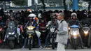 Pemudik berkendara sepeda motor bersiap masuk kapal penyeberangan di Dermaga 1 Pelabuhan Penyebrangan Merak, Banten, Sabtu (1/6/2019). Diperkirakan puncak arus mudik menuju pulau Sumatera akan terjadi pada Sabtu (1/6) dan Minggu (2/6). (Liputan6.com/Helmi Fithriansyah)