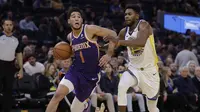 Aksi Devin Booker saat Suns kalahkan Warriors pada lanjutan NBA (AP)