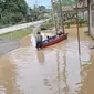 Banjir di Jalan Datu Nondol, Kelurahan Sepaku, Kecamatan Sepaku, Kabupaten Penajam Paser Utara yang merendam persawahan dan pemukiman penduduk pada 17 Maret 2023 silam.