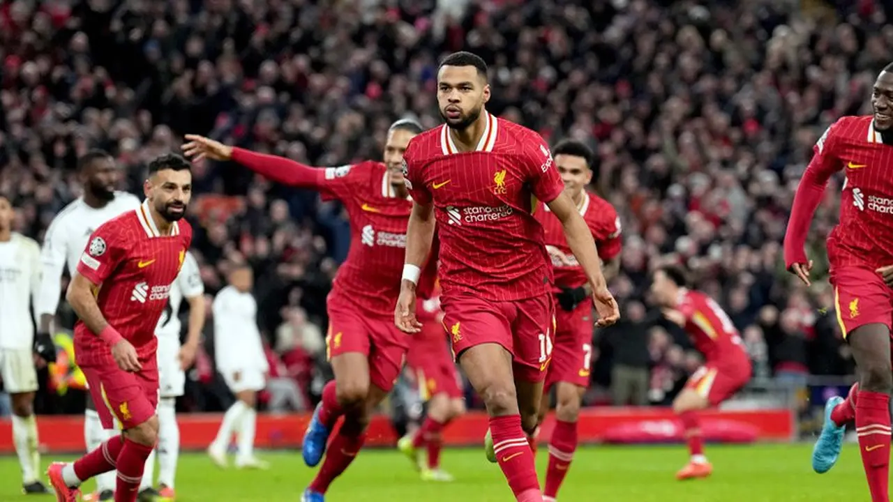 Selebrasi Cody Gakpo dalam laga Liga Champions antara Liverpool vs Real Madrid, Kamis (28/11/2024). (c) AP Photo/Jon Super