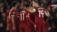 Para pemain Liverpool merayakan gol ke gawang AS Roma pada leg pertama semifinal Liga Champions, di Anfield, Selasa (24/4/2018). (AFP/Oli Scarff)