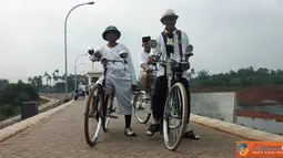 Citizen6, Tangerang: Pecinta sepeda ontel juga mengunjungi waduk Situ Gintung. (Pengirim: Fahrizal Razak) 