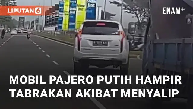 Mobil Pajero putih hampir bertabrakan dengan truk. Hal tersebut terjadi setelah memotong jalan mendadak