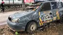 Sebuah mobil patroli Polsek Tanah Abang tampak mangkrak dan tidak terurus di kawasan Tanah Abang, Jakarta, Rabu (6/3). Mobil operasional merk KIA dibiarkan dipinggir jalan. (Liputan6.com/Fery Pradolo)