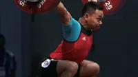 Ekspresi Eko Yuli Irawan mengangkat beban 135 kg snacth saat turun pada kelas 62 kg di Hall A Arena PRJ, Jakarta, Rabu (11/2/2018). Eko berhasil menyabet medali emas. (Bola.com/Nicklas Hanoatubun)