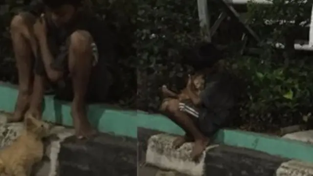 Buat Haru, Seorang Anak Ajak Kucing Jalanan Mengobrol Hingga Dipeluk