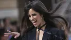 Camila Cabello tertawa saat berjalan di catwalk memakai kreasi dari koleksi L'Oreal Ready To Wear Spring-Summer 2020 selama pekan mode di Paris (28/9/2019). Penyanyi 22 tahun ini tampil seksi mengenakan blazer dan celana hitam yang menjuntai di landasan. (Photo by Vianney Le Caer/Invision/AP)