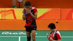 Ekspresi Tontowi Ahmad/Liliyana Natsir usai mengalahkan Praveen Jordan/Debby Susanto di perempat final Bulutangkis Olimpiade Rio 2016, Senin (15/8). Kemenangan ini mengantarkan Tontowi Ahmad/Liliyana Natsir  ke semifinal. (REUTERS)