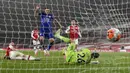 Striker Leicester City, Jamie Vardy, melakukan selebrasi usai mencetak gol ke gawang Arsenal pada laga Premier League di Stadion Emirates, Selasa (7/7/2020). Kedua tim bermain imbang 1-1. (AP Photo/Shaun Botterill,Pool)