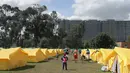 Suasana kamp bagi para migran Venezuela yang tunawisma di Bogota, Kolombia (21/11). Kamp imigran  tersebut dibangun oleh sekretaris kesejahteraan sosial kota yang dapat menampung lebih dari 400 orang. (AP Photo/Ivan Valencia)