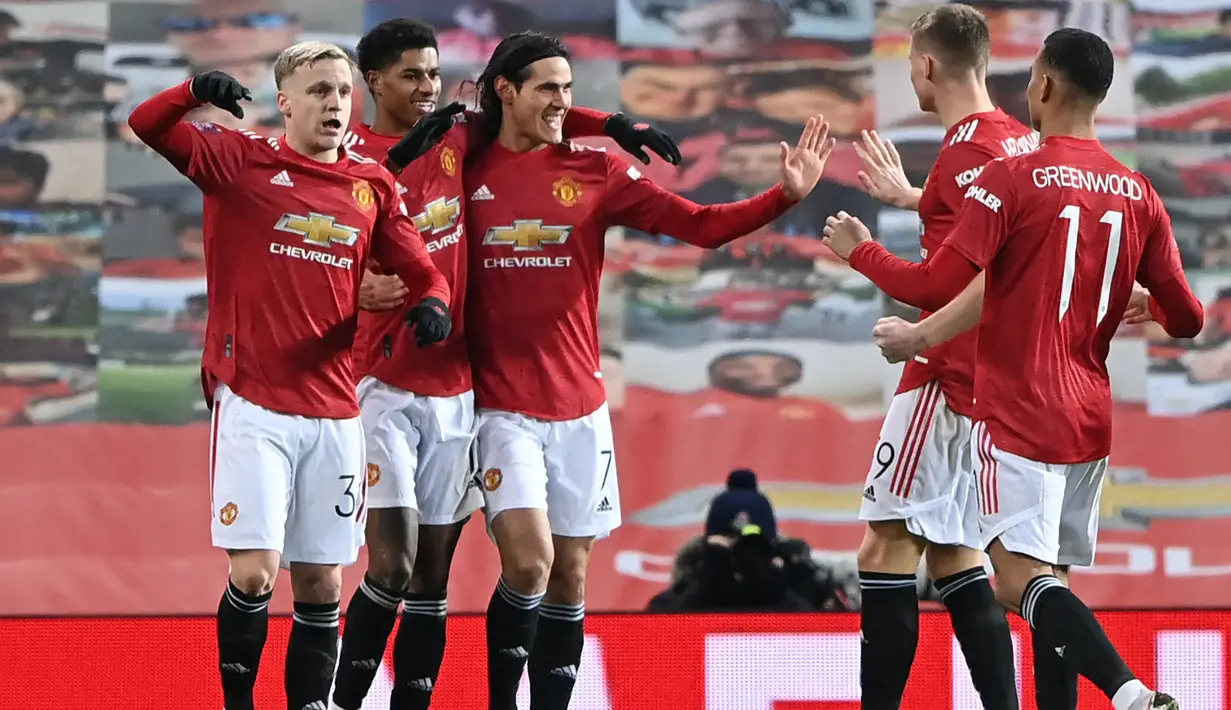 Pertemuan ketiga alias terakhir Manchester United dan Liverpool di Old Trafford pada pada ajang Piala FA terjadi pada putaran keempat musim 2020/2021 (24/1/2021). Hasilnya, MU menang 3-2 lewat gol-gol dari Mason Greenwood (26'), Marcus Rashford (48') dan Bruno Fernandes (78'). Sementara dua gol Liverpool dicetak lewat brace Mohamed Salah (18' dan 58'). (AFP/Pool/Laurence Griffiths)