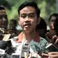 Putra Presiden Joko Widodo, Gibran Rakabuming Raka memberikan keterangan seusai bertemu Ketum PDIP Megawati Soekarnoputri di Jalan Teuku Umar, Jakarta, Kamis (24/10/2019). Kedatangan Gibran menyampaikan ihwal niat maju dalam pencalonan Wali Kota Solo melalui jalur partai. (merdeka.com/Iqbal Nugroho)