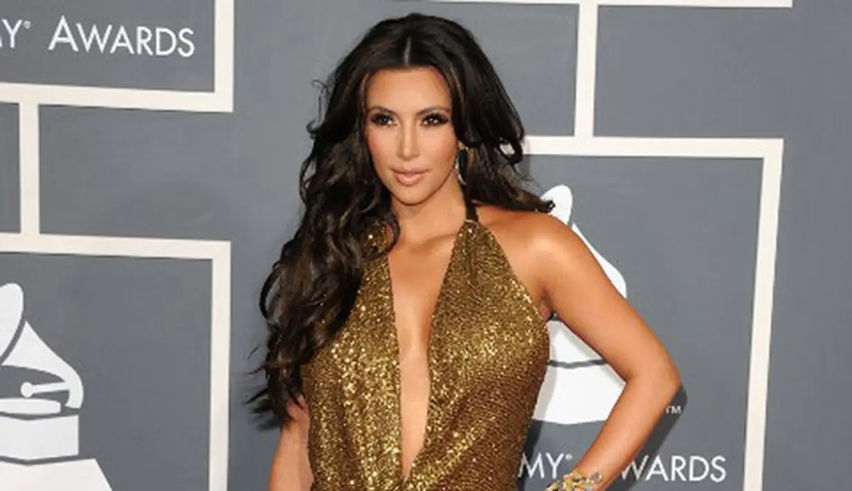 Kim Kardashian, salah satu selebriti Hollywood yang tak pernah sepi dari sorotan publik. Selain kisah hidupnya yang penuh drama, gaya berbusananya pun kerap menjadi perhatian masyarakat dunia. (AFP/JASON MERRITT)