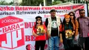 Posko Relawan Pendukung Ahok ramaikan suasana Car Free Day di Bundaran HI, Jakarta, Minggu (15/3/2015). Aksi pengumpulan tanda tangan sebagai bentuk dukungan kepada Gubernur DKI Jakarta memberantas korupsi di DPRD Jakarta. (Liputan6.com/Yoppy Renato)