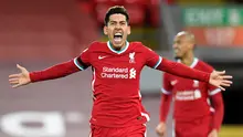 Rekan Salah di Liverpool, Roberto Firmino telah terlebih dahulu mencetak hattrick untuk The Reds saat mengalahkan Watford 5-0 pada pekan kedelapan (16/10/2021) Liga Inggris 2021/2022. Hal tersebut merupakan hattrick kedua Firmino selama kariernya di Liga Inggris. (AFP/Peter Powel)