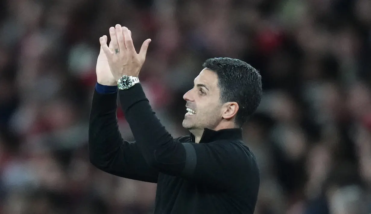 Wajah bahagia terpancar dari Mikel Arteta setelah Arsenal berhasil meraih kemenangan penting saat menjamu Burnley dalam lanjutan Premier League 2025/2026. Bermain di Emirates Stadium, Selasa (19/5/2026) dini hari WIB, The Gunners menang tipis 1-0 lewat gol Kai Havertz. (AP Photo/Kirsty Wigglesworth)