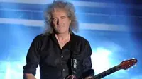 brian may rela bayar tiket pesawat untuk gitarnya