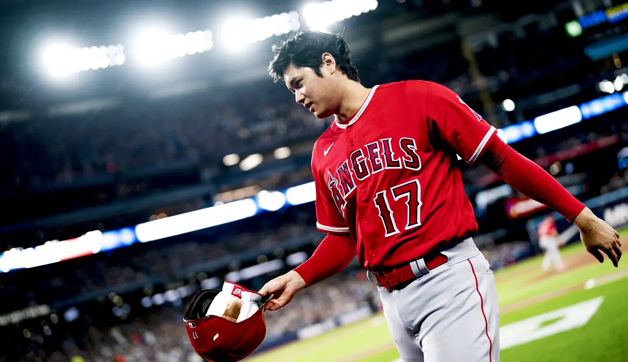 Dunia olahraga baru saja dibuat heboh setelah Shohei Ohtani menandatangani kontrak dengan Los Angeles Dodgers selama 10 tahun dengan nilai menacapai 700 juta dolar Amerika Serikat atau sekitar 10,8 triliun rupiah. (Getty Images/AFP/Mark Blinch)