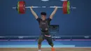 <p>Atlet angkat besi Indonesia, Rizki Juniansyah berhasil mengangkat beban seberat 199 kg pada angkatan clean and jerk saat berlomba pada kelas 73 kg putra cabor angkat besi Olimpiade Paris 2024 di Paris Expo Porte de Versailles, Paris, Kamis (8/8/2024). (AP Photo/Kin Cheung)</p>