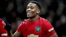 Striker Manchester United, Anthony Martial berselebrasi usai mencetak gol ke gawang Norwich City pada pertandingan lanjutan Liga Inggris di Old Trafford (11/1/2020). MU menang telak 4-0 atas Norwich. (Martin Rickett/PA via AP)