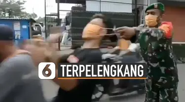 Video pengendara motor hampir terpelengkang saat dipakaikan masker oleh anggota TNI viral di media sosial.
