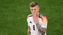 Toni Kroos pensiun setelah Jerman menelan kekalahan di perempat final Piala Eropa melawan Spanyol. Kroos memenangkan La Liga dan Liga Champions pada musim terakhirnya di Real Madrid. Akan tetapi, kesuksesan itu tidak menular saat Kroos membela Jerman di Euro 2024. (Kirill KUDRYAVTSEV / AFP)